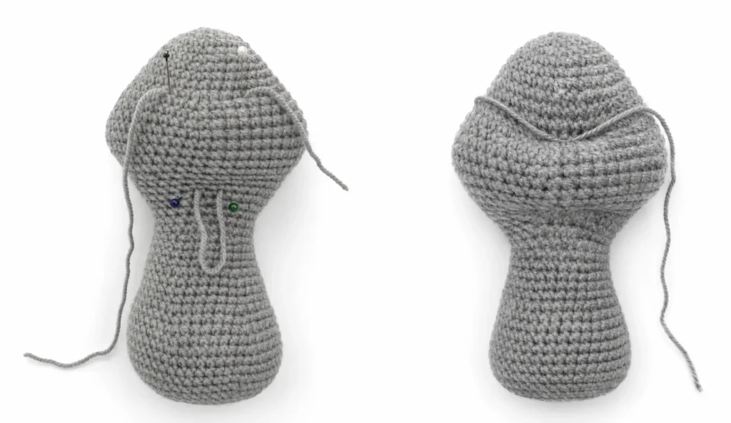 Front and back views of a stuffed gray amigurumi bunny body showing how to thread yarn and use pins to sculpt facial features.
