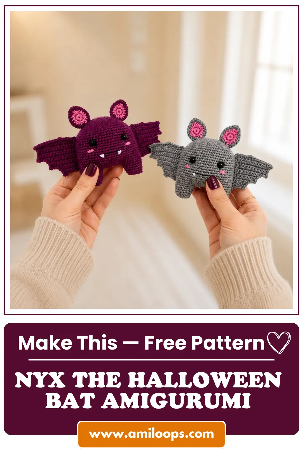 Hands presenting purple and grey crochet bat toys in front of a white bookshelf and framed floral artwork.