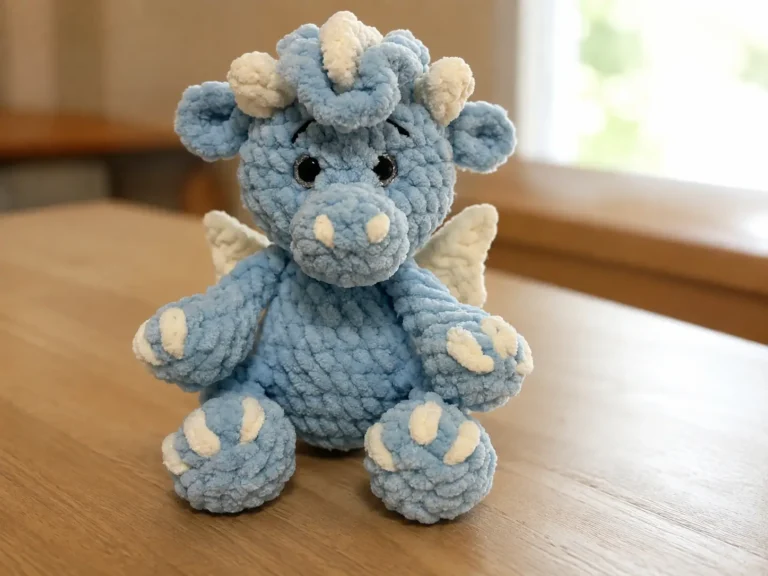 Collage of a blue crochet baby dragon amigurumi indoors, in a woven basket, and sitting on a beige couch.