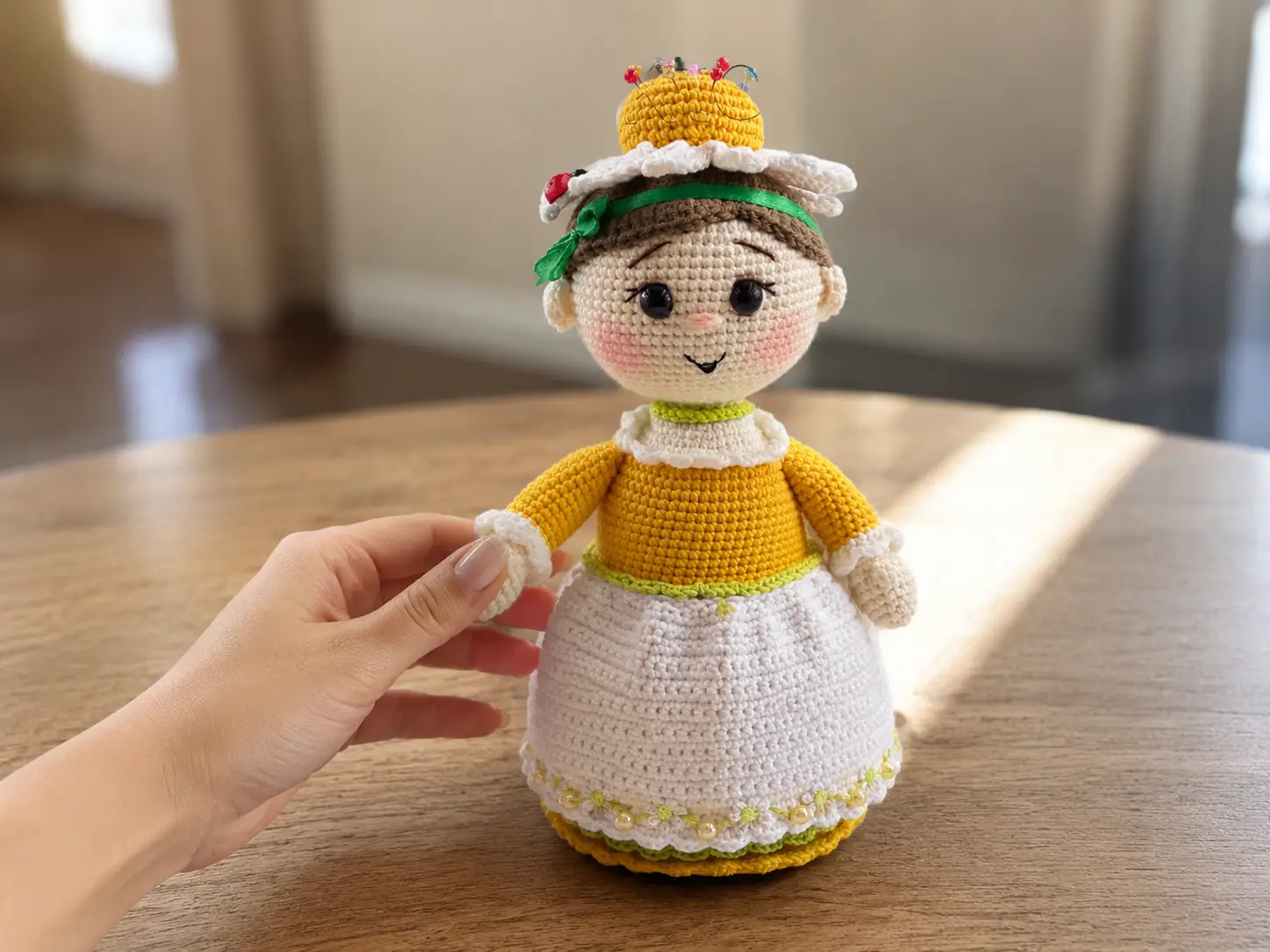 A crocheted doll with a yellow chamomile flower crown and white apron covering a small glass jar.