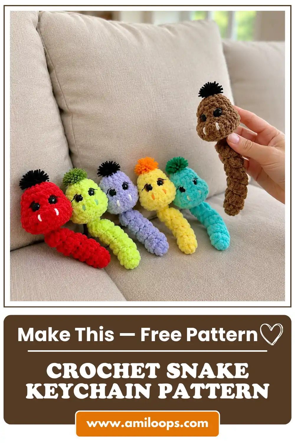 colorful plush yarn snakes lined up on a beige couch, hand holding a brown one. A cute crochet snake keychain pattern.