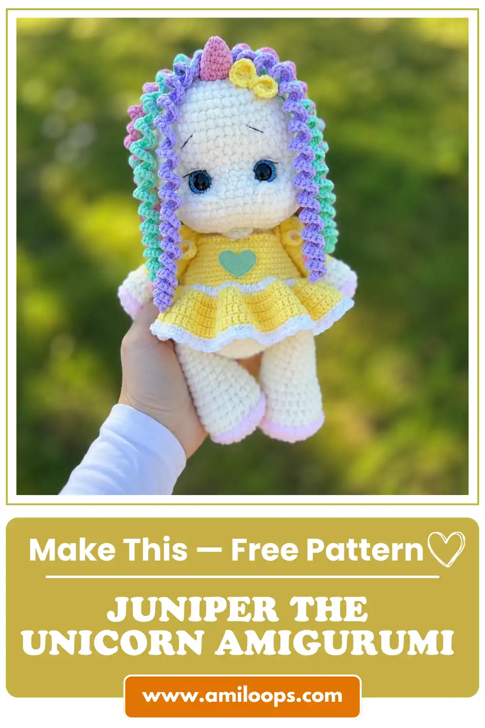 Hand holding a white chunky yarn doll with a yellow dress outdoors. Try our crochet unicorn amigurumi pattern free today.