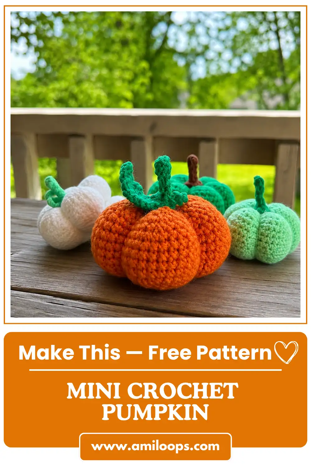 Four yarn pumpkins on a wooden deck table showcasing a free crochet pumpkin pattern in orange, white, and green.