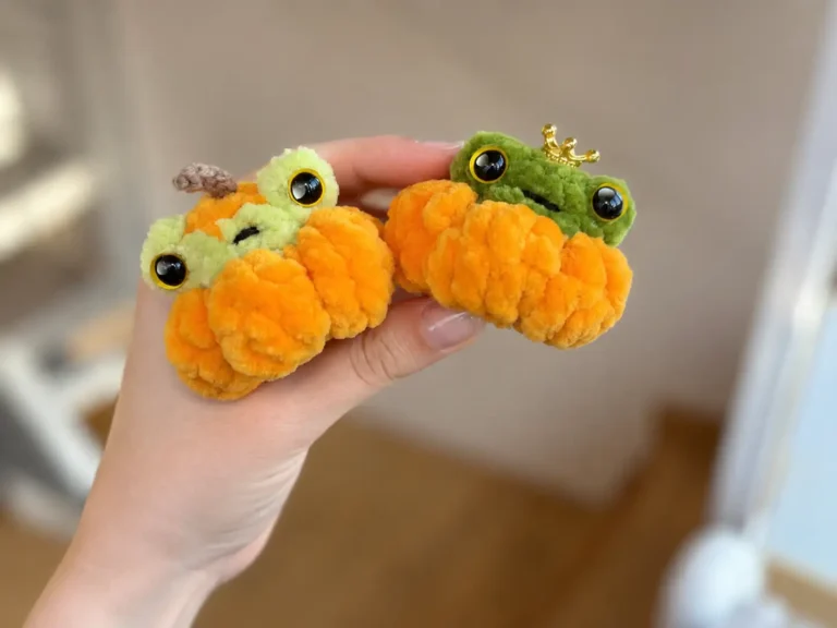 Collage of a hand holding two crochet pumpkin frog amigurumi with close-ups of their green faces and orange chenille bodies.