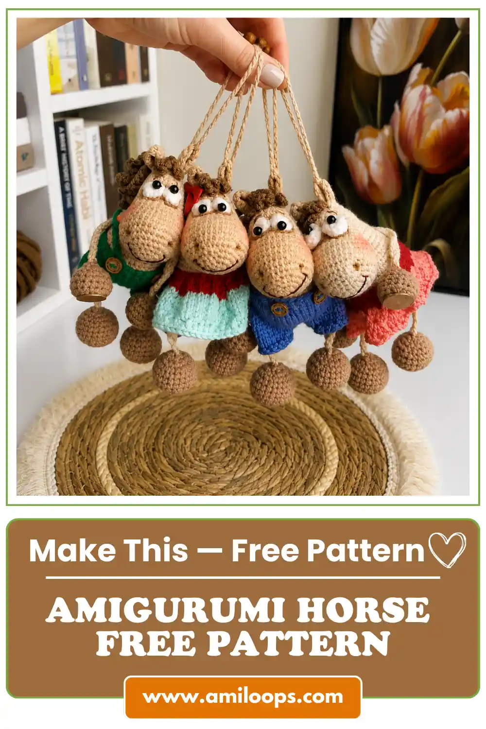 Four crocheted horses in green, teal, blue and pink clothes held by strings, using an amigurumi horse free pattern.