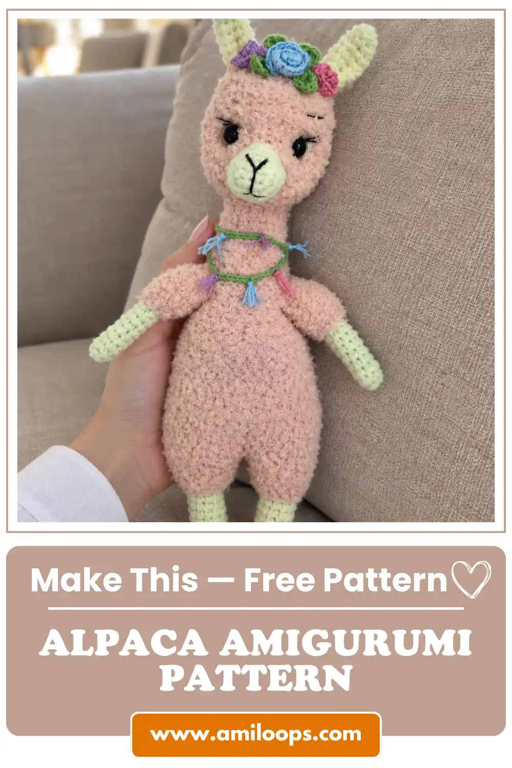 Peach toy with green limbs from this alpaca amigurumi pattern, wearing a flower crown and resting against a beige couch.