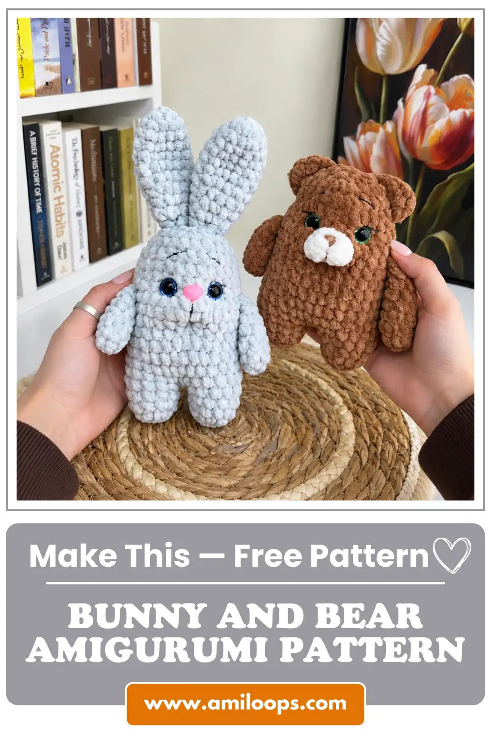 Close-up of handmade fuzzy light blue bunny and brown bear crochet toys held over a woven mat with a floral art backdrop.